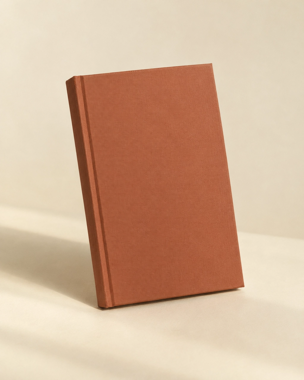 Photo: a plain terracotta hardcover book (placeholder for Kimberly’s own photography)