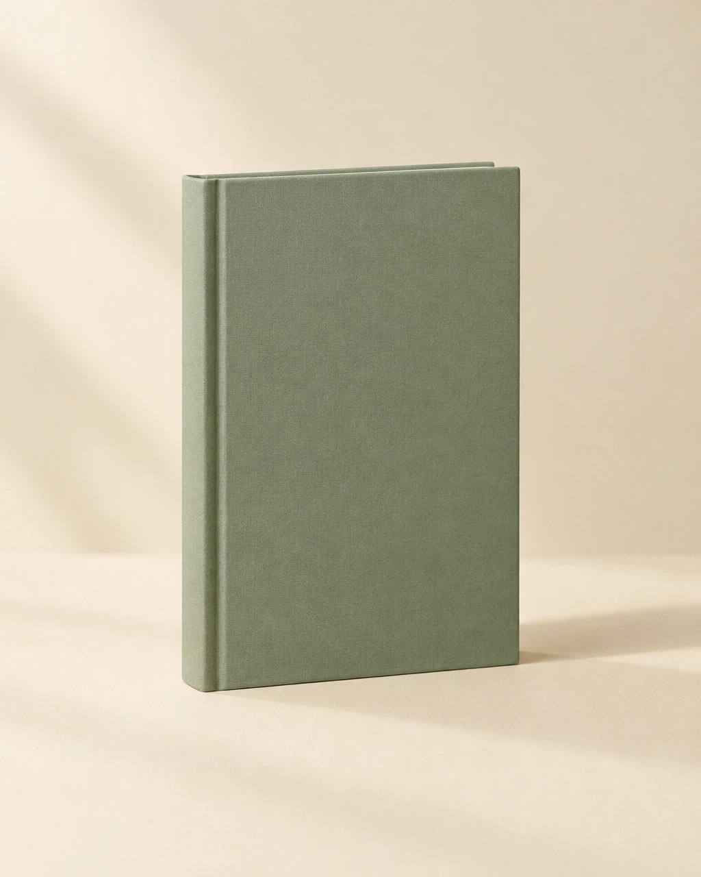Photo: a plain sage hardcover book (placeholder for Kimberly’s own photography)